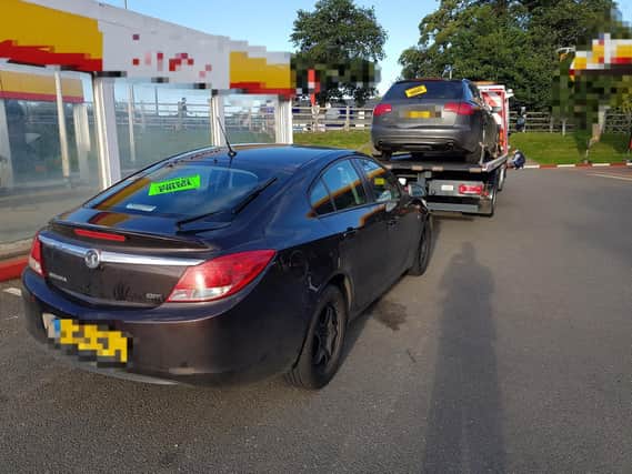 It's a two-for-one as Police tow away both uninsured cars from the Towcester garage
