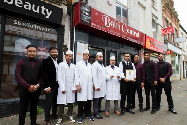 Balti Central staff outside the Marefair restaurant after being named 'curry house of the year' by Chron readers