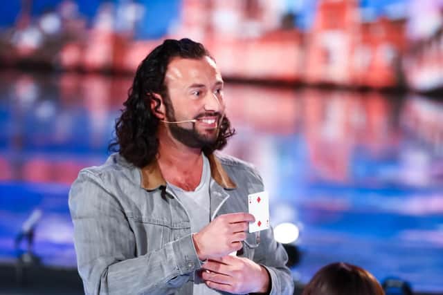 Sean Heydon shows the card Simon Cowell thought of after completing his trick on Britain's Got Talent: Unseen. Photo: Thames Media/ITV