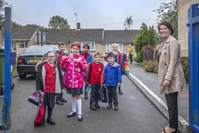 Little Houghton headteacher Carolyn Fairbrother was stood at the school gates this morning to give her new and returning pupils a reassuring wave and smile. Pictures by Kirsty Edmonds.