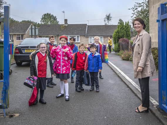 Little Houghton headteacher Carolyn Fairbrother was stood at the school gates this morning to give her new and returning pupils a reassuring wave and smile. Pictures by Kirsty Edmonds.