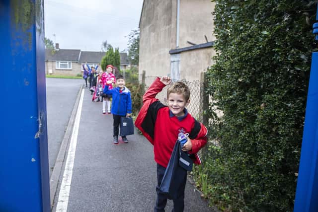 It was bookbags-at-the-ready as the children lined up for their classes. Pictures by Kirsty Edmonds.