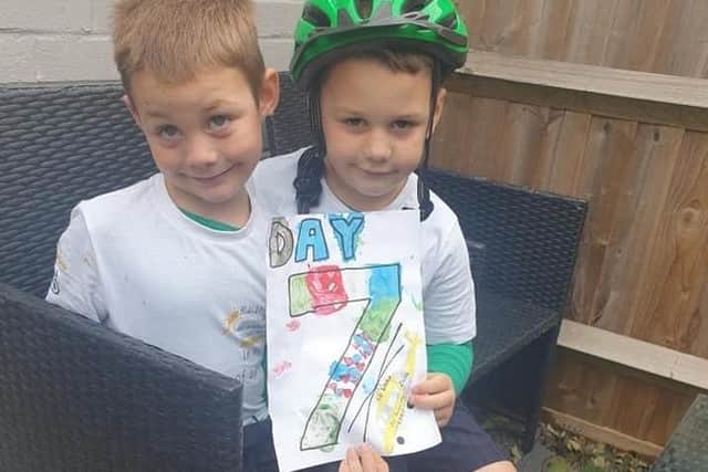 Ethan and Oscar celebrate reaching day seven of their epic charity cycle ride: Photo: Warwickshire & Northants Air Ambulance