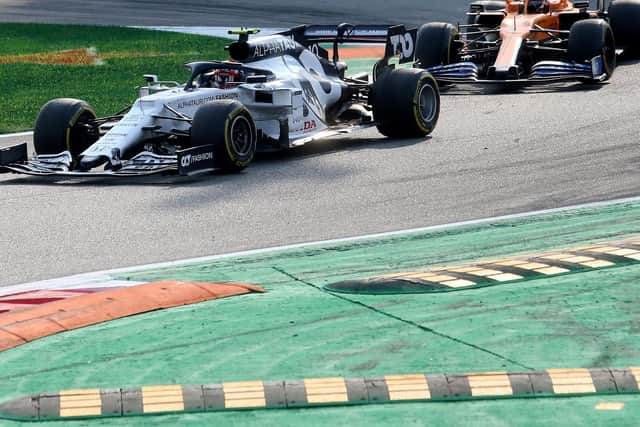 Carlos Sainz battles for the lead with Gasly