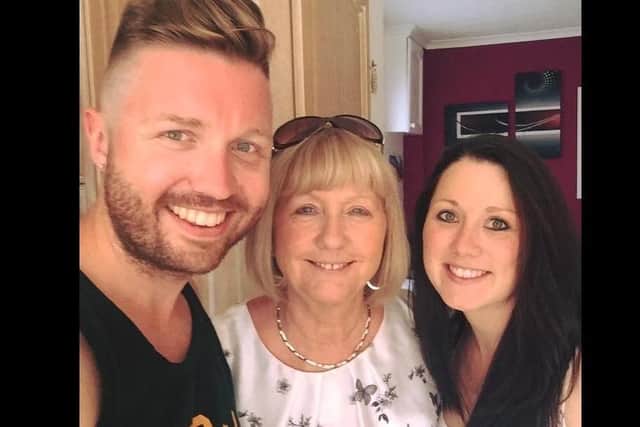 Marion (centre) with her son Gary and daughter Toni