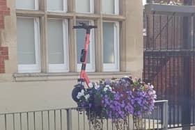 One of the Voi scooters was left outside The Old White Hart pub, on the railings, leaving members of the public to lift it down.