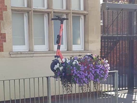 One of the Voi scooters was left outside The Old White Hart pub, on the railings, leaving members of the public to lift it down.