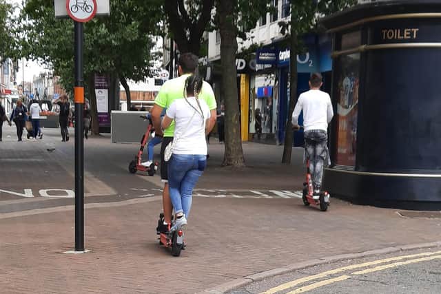 E-scooter users pictured riding in Abington Street on Sunday morning.