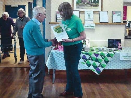John being thanked for his efforts at a previous coffee morning.