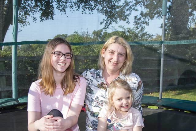 Amiee (left) is having to miss school because the local authority has not provided the transport she is entitled to. Pictured with her mum Louise and sister Harriet.