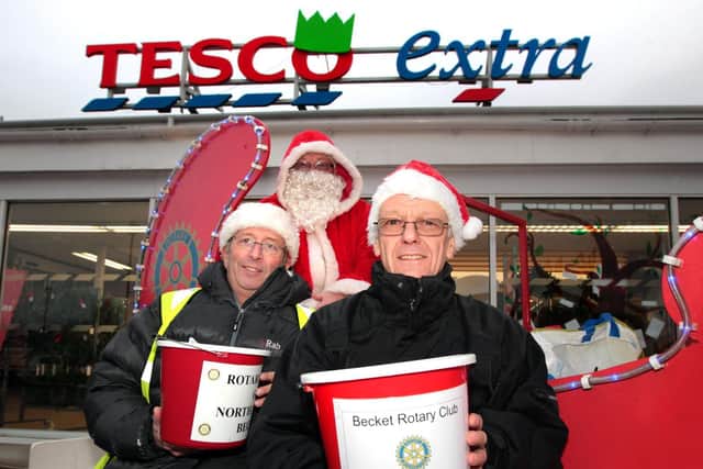 Paul (pictured right) with Robert Kingham (left) and Alan Bunn (back) outside Tesco Mereway where they fundraise annually with their sleigh.