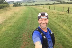 Mark Wilson takes a selfie on one of his cross-country runs