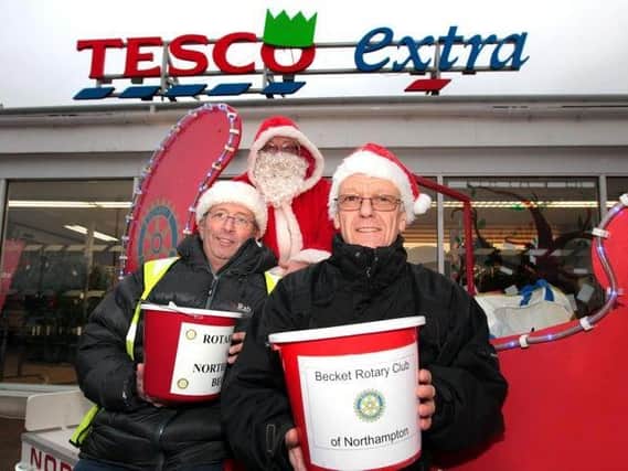 Paul (pictured right) with Robert Kingham (left) and Alan Bunn (back) outside Tesco Mereway, where Rotary Becket fundraised annually with their sleigh.