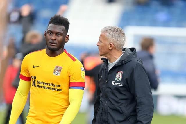 Keith Curle and Aaron Pierre.