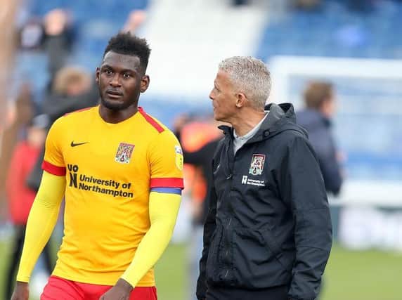 Keith Curle and Aaron Pierre.