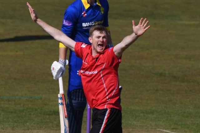 Tom Taylor claimed two wickets and hit an unbeaten 50 on his Northants debut