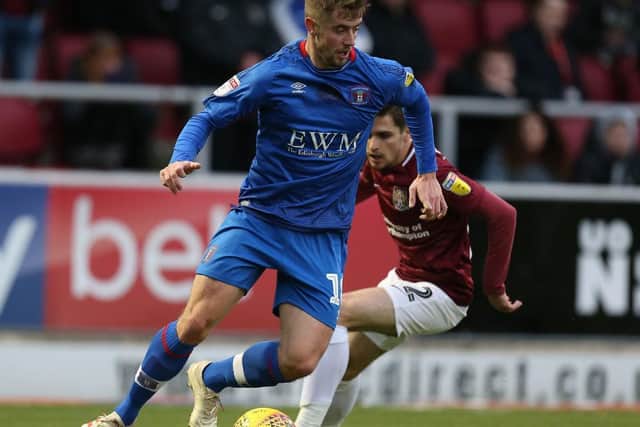 Jack Sowerby, on loan with Carlisle at the time, in action against the Cobblers.