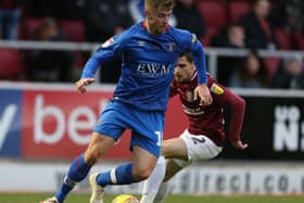 Jack Sowerby, on loan with Carlisle at the time, in action against the Cobblers.