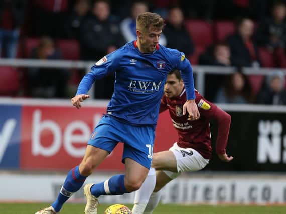 Jack Sowerby, on loan with Carlisle at the time, in action against the Cobblers.