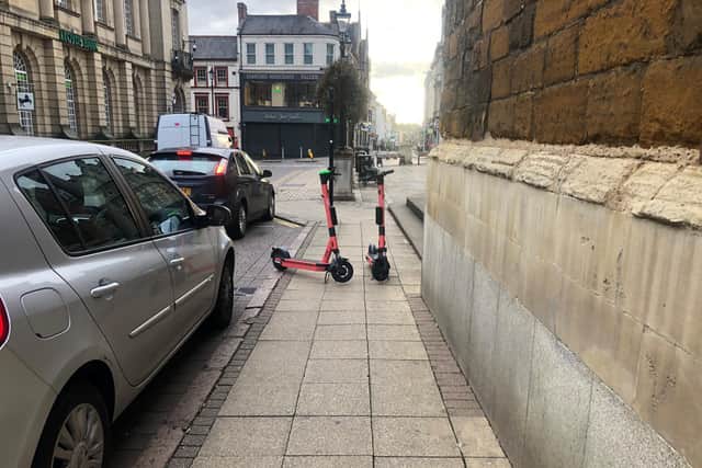 E-scooters are being left parked in the middle of the pavements - here they are near All Saints Church.