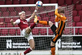 Ryan Watson challenges for the ball during the Cobblers' clash with Hull City (Pictures: Pete Norton)