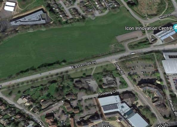The site is currently vacant open land.