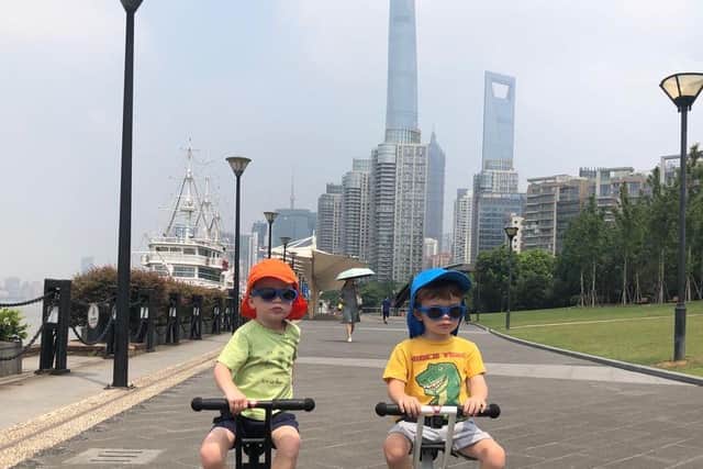 Andy James' four-year-old twins, Oliver and Finlay, taking part in the virtual Cycle4Cynthia on their scooters in Shanghai