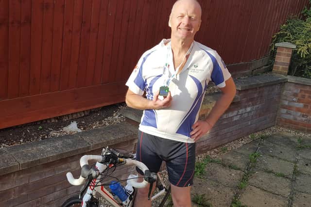Michael Leszczyszyn proudly sports his Cycle4Cynthia 2020 medal having completed his ride