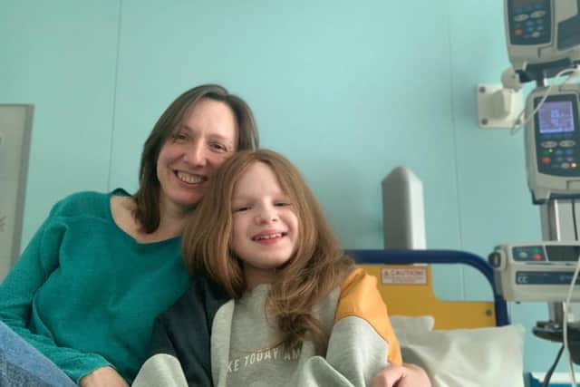 Maisie and her mum pictured in hospital