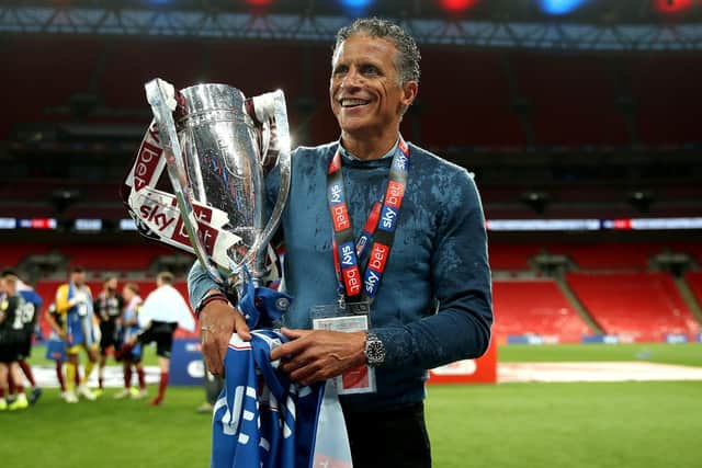 Cobblers boss Keith Curle with the league two play-off trophy after the win at Wembley in June