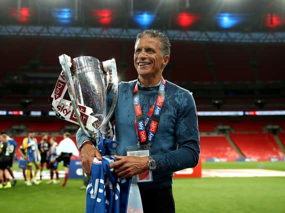 Cobblers boss Keith Curle with the league two play-off trophy after the win at Wembley in June