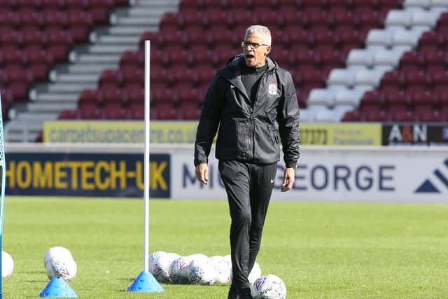 Keith Curle takes training in his first week as Cobblers boss