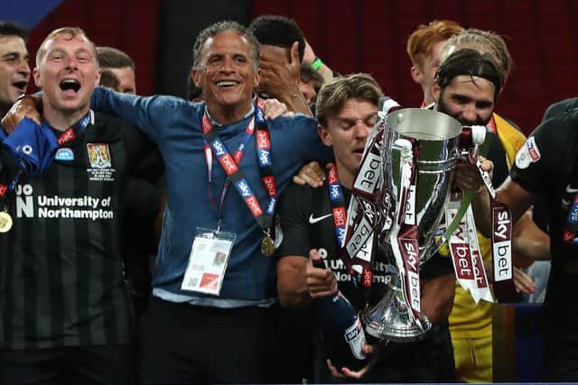Sam Hoskins and Keith Curle celebrate after the Cobblers' play-off final win at Wembley in June