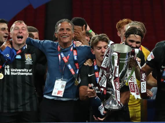Sam Hoskins and Keith Curle celebrate after the Cobblers' play-off final win at Wembley in June