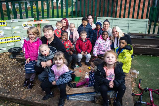 Hayley pictured right with pupils and staff at Blackthorn Good Neighbours Nursery.