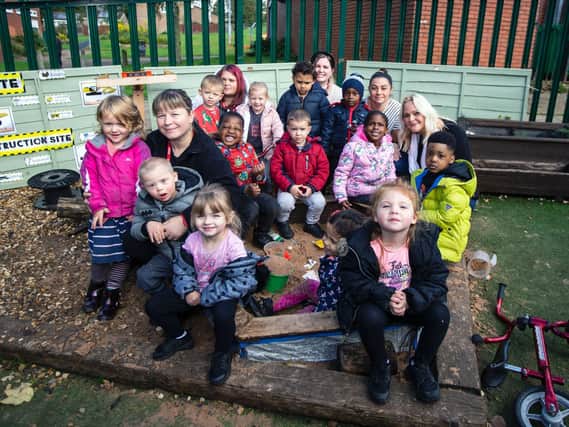 Hayley pictured right with pupils and staff at Blackthorn Good Neighbours Nursery.