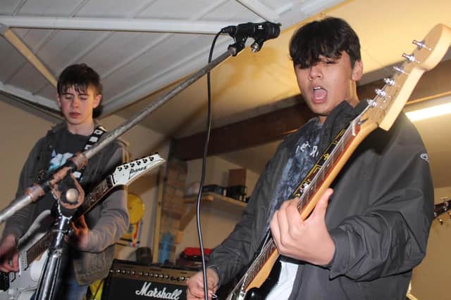 Tristan and Bradley O'Dwyer during rehearsals in Matthew's parents' garage