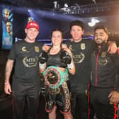 Chantelle Cameron and her team celebrate after she claimed the world title on Sunday night