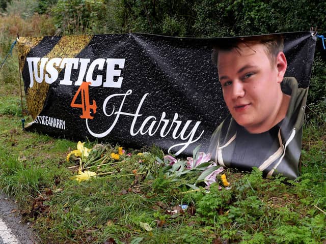 A Justice4Harry banner at the site of Harry Dunn's fatal crash near Croughton, Northamptonshire