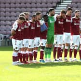 Cobblers and Peterborough held a minute's silence in honour of Tommy Robson who died aged 76 earlier this week. Pictures: Pete Norton