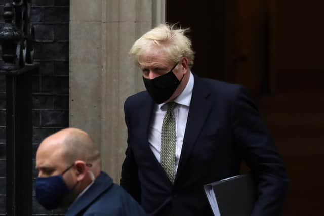 Boris Johnson leaving Downing Street to address the commons today (October 12).