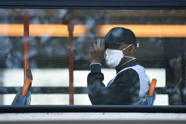 Face coverings have been required by law on buses since June. Photo: Getty Images