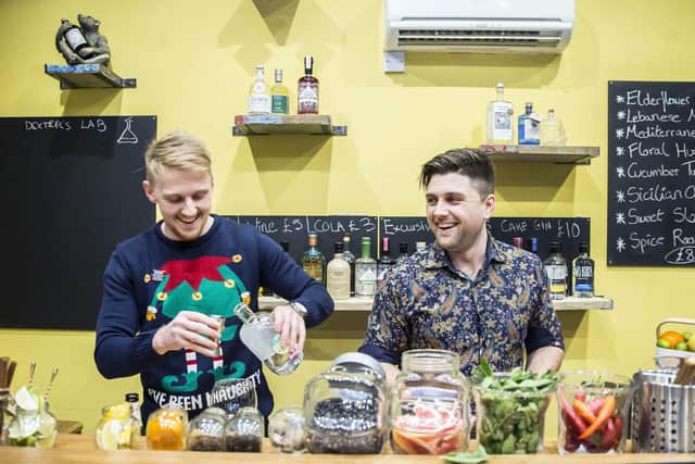 Pals and fellow engineers Max and Cillian pictured behind the bar during their soft launch night in December 2018.