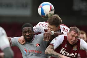 Fraser Horsfall and Nicky Adams battle with Charlton striker Omar Bogle (Pictures: Pete Norton)