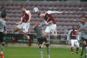 Fraser Horsfall wins a header. Pictures: Pete Norton