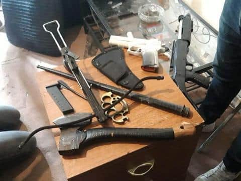 This crossbow, rifle and chopper are among the weapons that have been seized by police