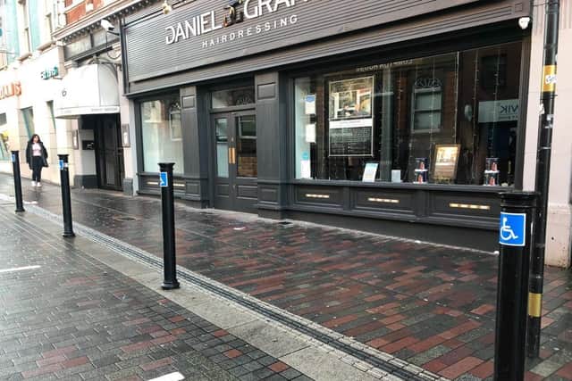 Hairdresser Daniel Granger says the stickers - pictured - may have been against regulation but they were clear and helpful.