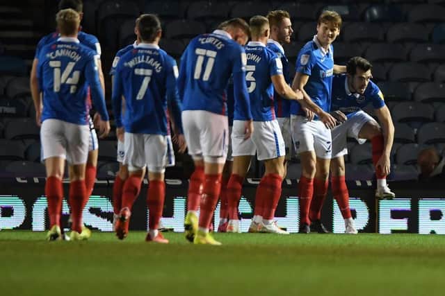 John Marquis and his Pompey team-mates celebrate their first goal in the win over the Cobblers