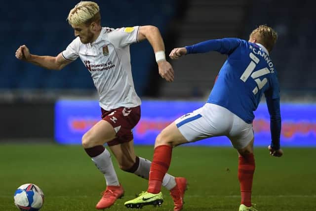Ryan Watson o n the ball for the Cobblers at Pompey
