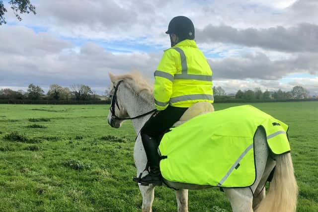 The duo trotted around a field in high-visibility coats to help raise the profile of the new initiative. Photo: Julia Harris.